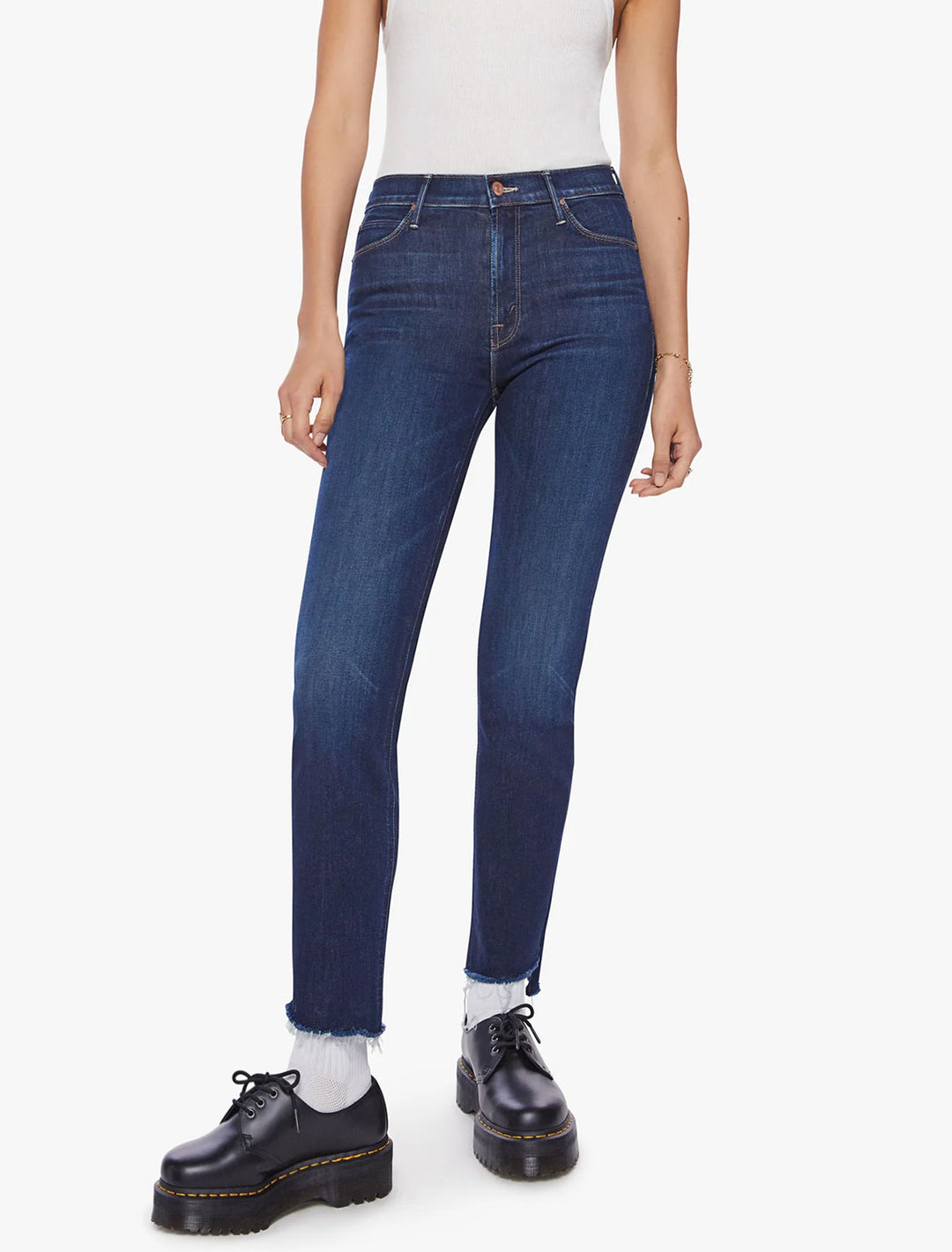 Model wearing Mother Denim's the mid rise dazzler ankle step in off limits.