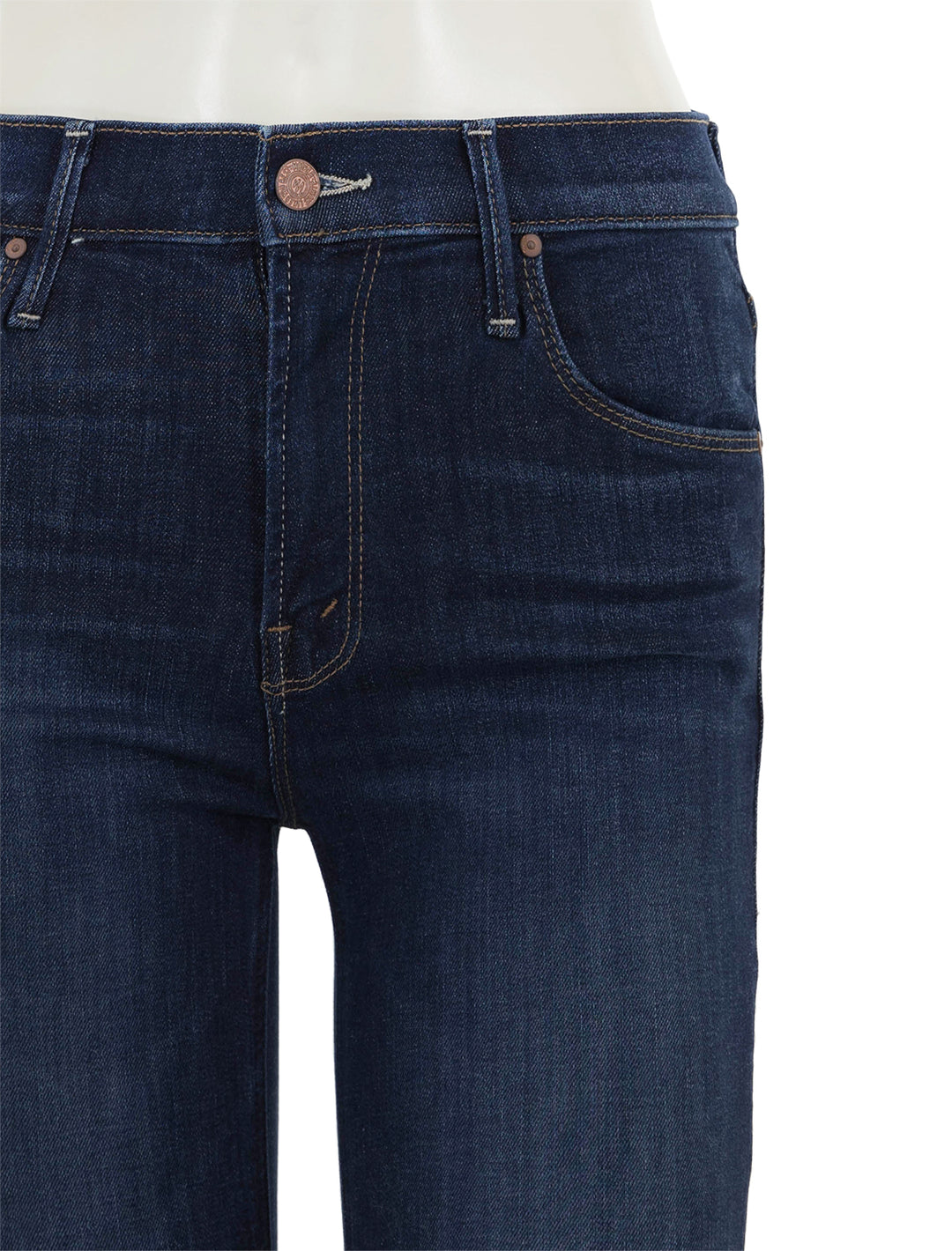 Close-up view of Mother Denim's the mid rise dazzler ankle step in off limits.