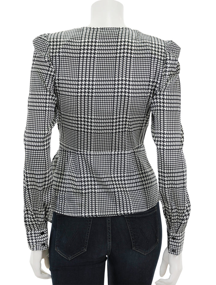 Back view of L'agence's bensen wrap blouse in ivory and black plaid.