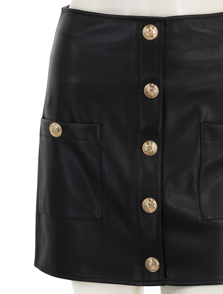 Close-up view of L'agence's truman mini skirt in black.