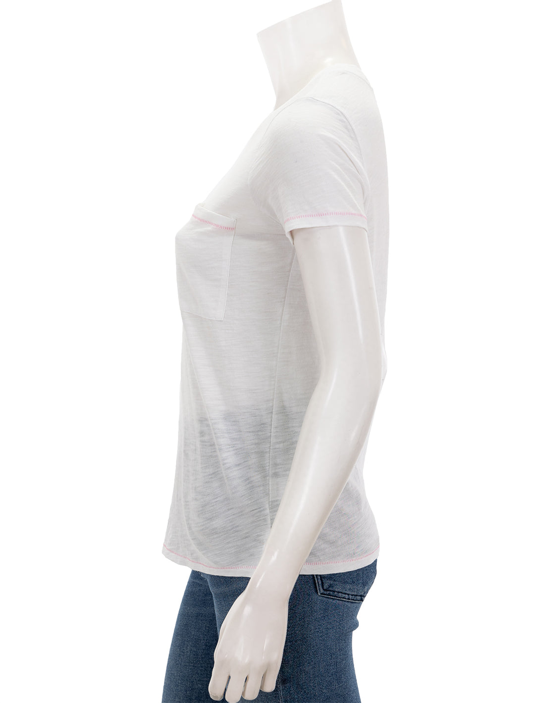 Side view of Goldie Lewinter's contrast stitch pocket boy tee in white and pink.