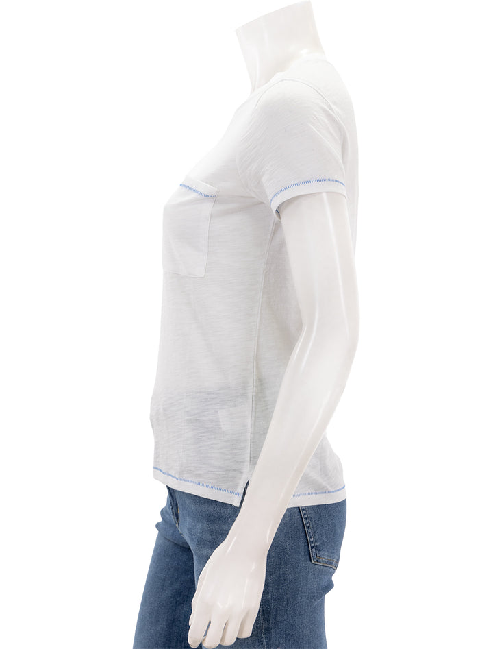 Side view of Goldie Lewinter's contrast stitch pocket boy tee.