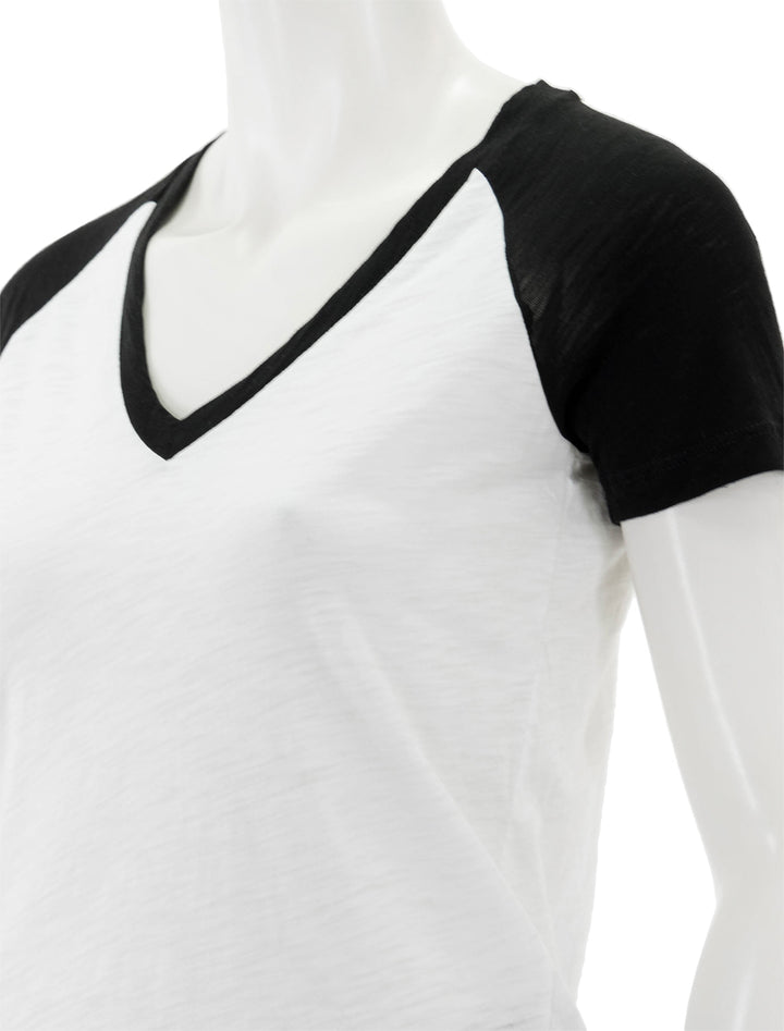 Close-up view of Goldie Lewinter's short sleeved baseball tee in black.