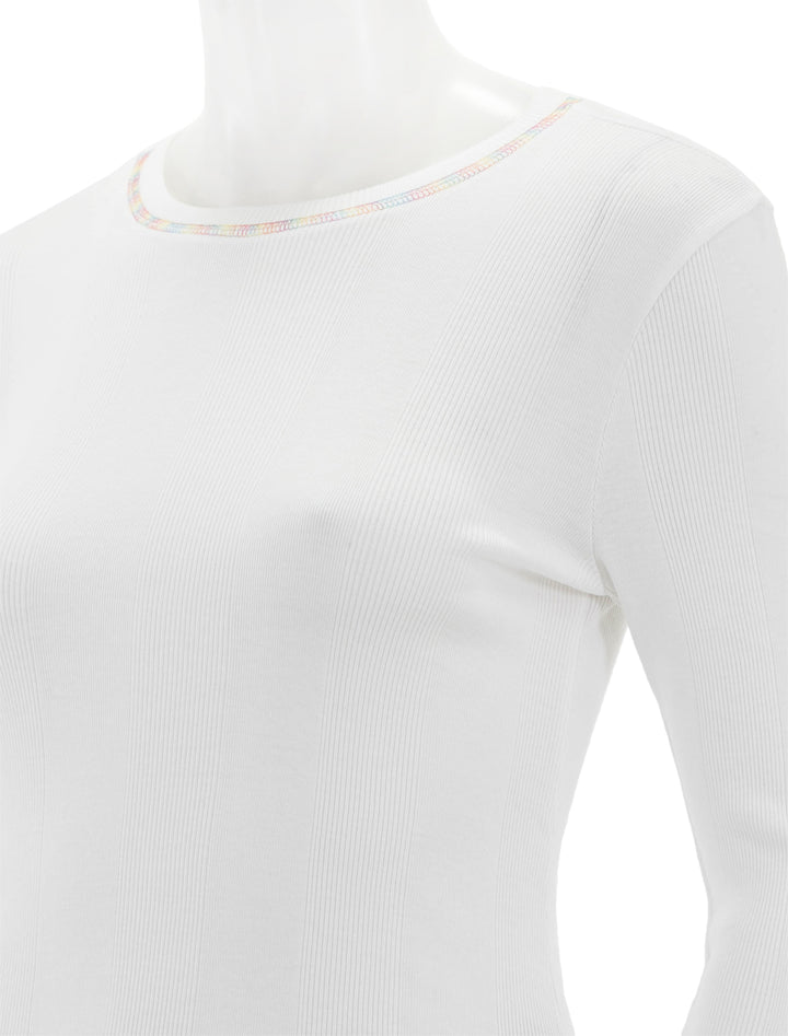 Close-up view of Goldie Lewinter's rainbow stitch long sleeve cotton rib tee in white.