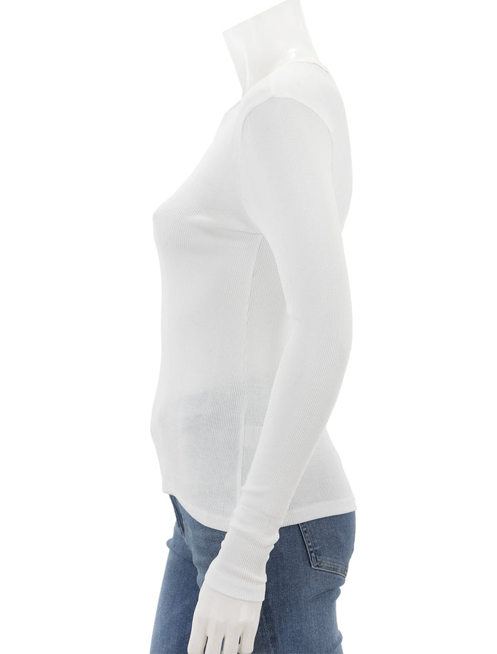 Side view of Goldie Lewinter's rainbow stitch long sleeve cotton rib tee in white.