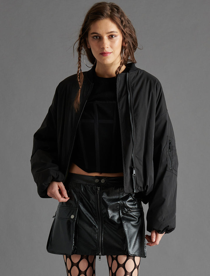 Model wearing Steve Madden's vida jacket in black.