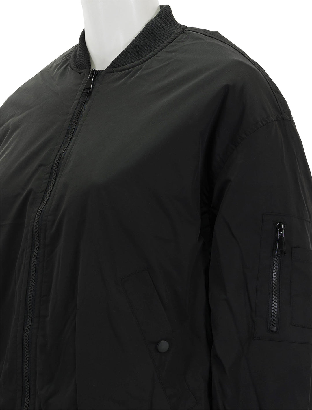 Close-up view of Steve Madden's vida jacket in black.