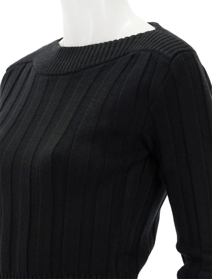 Close-up view of Steve Madden's serra sweater in black.