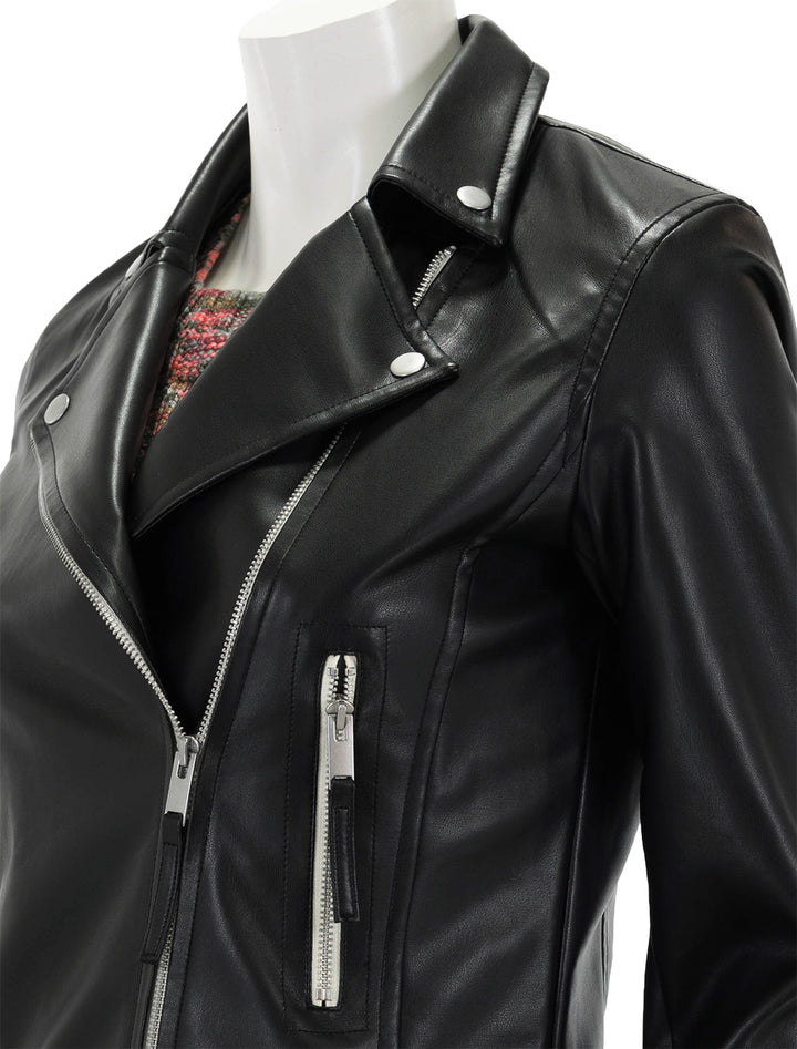 Close-up view of Steve Madden's vinka jacket in black.