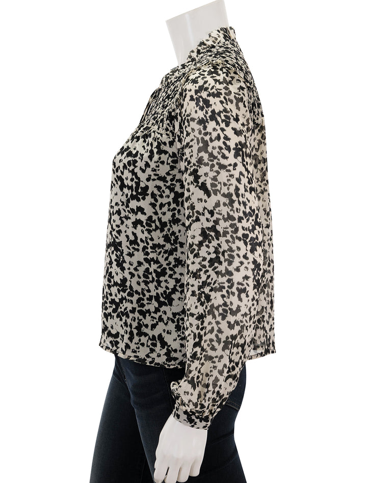 Side view of Steve Madden's drew top in black and ivory floral.