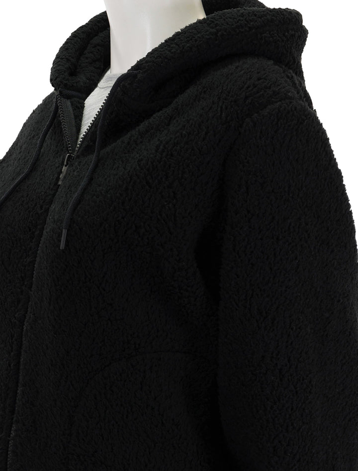 Close-up view of Splendid's elsa teddy jacket in black.