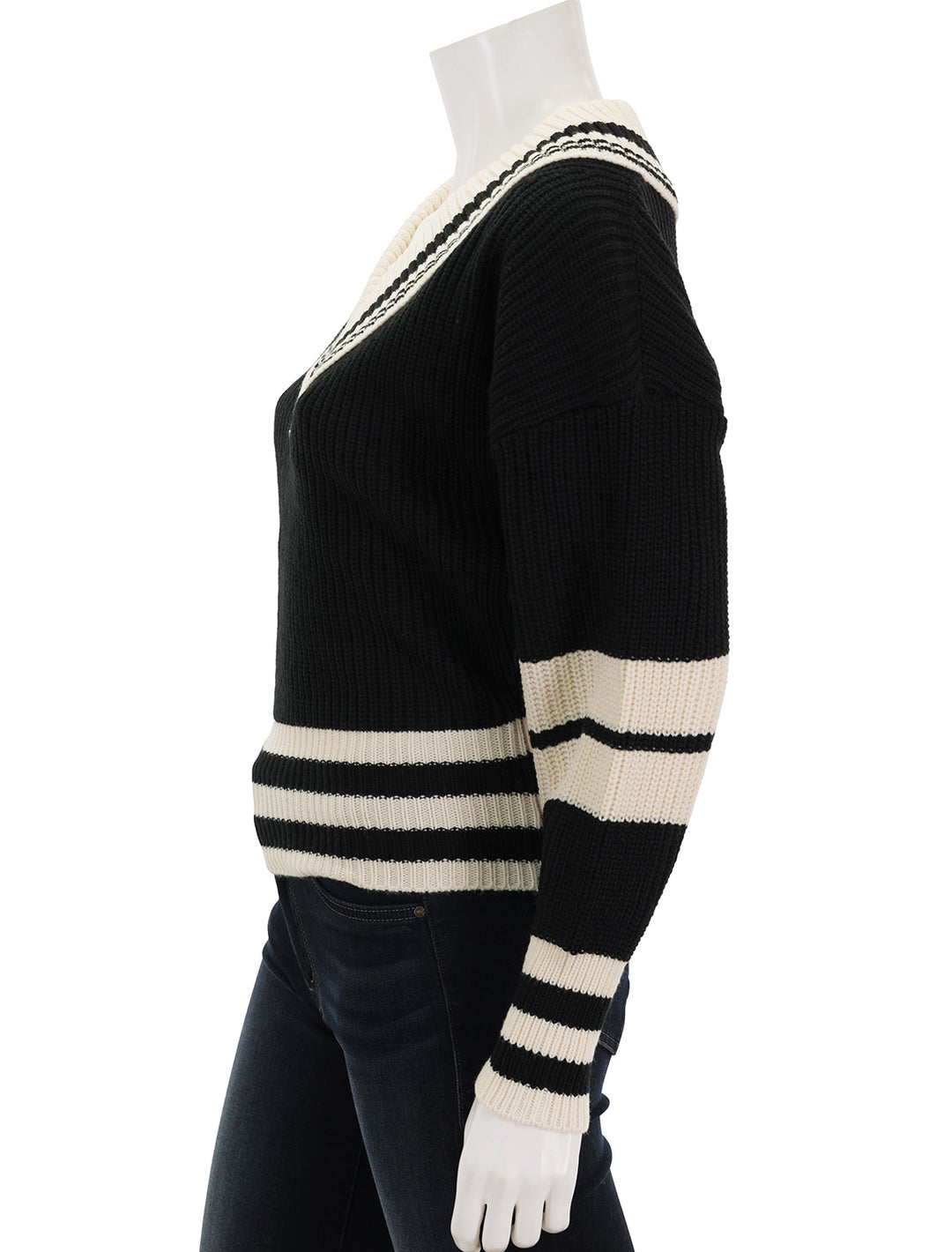 Side view of Steve Madden's jen sweater in black and ivory.