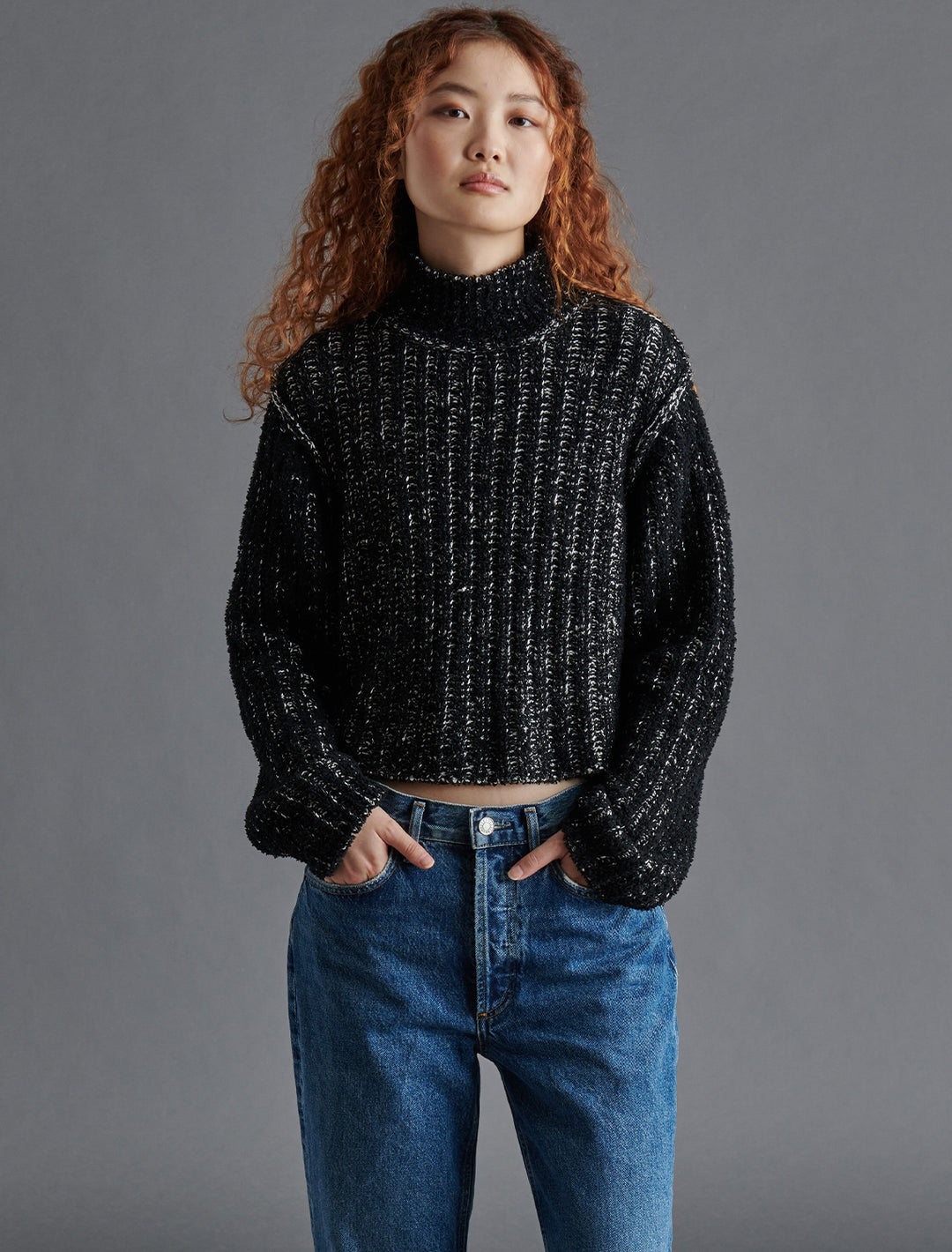 Model wearing Steve Madden's Kirsten Sweater in Black Multi.