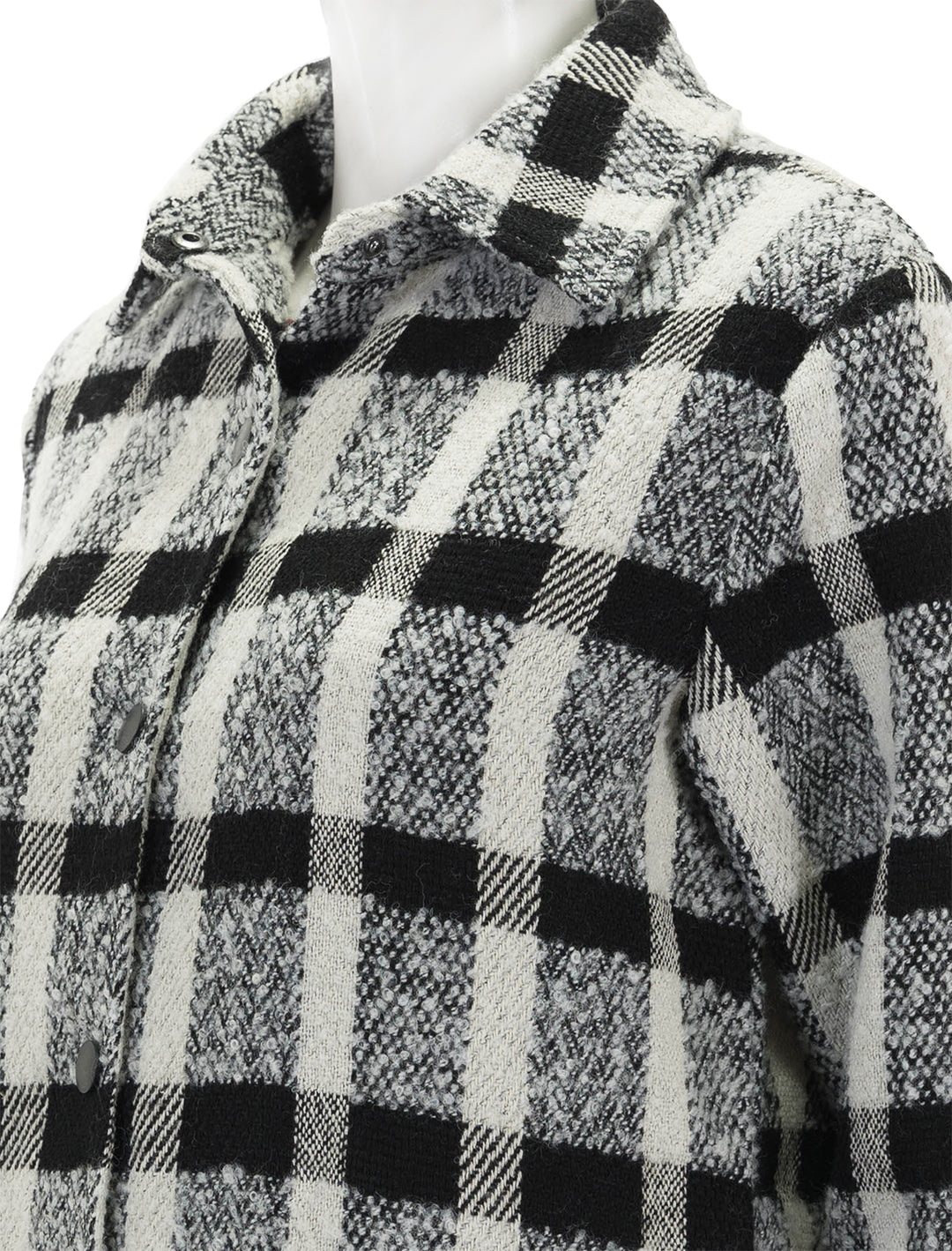 Close-up view of Steve Madden's eldridge shirt jacket in black and white plaid.