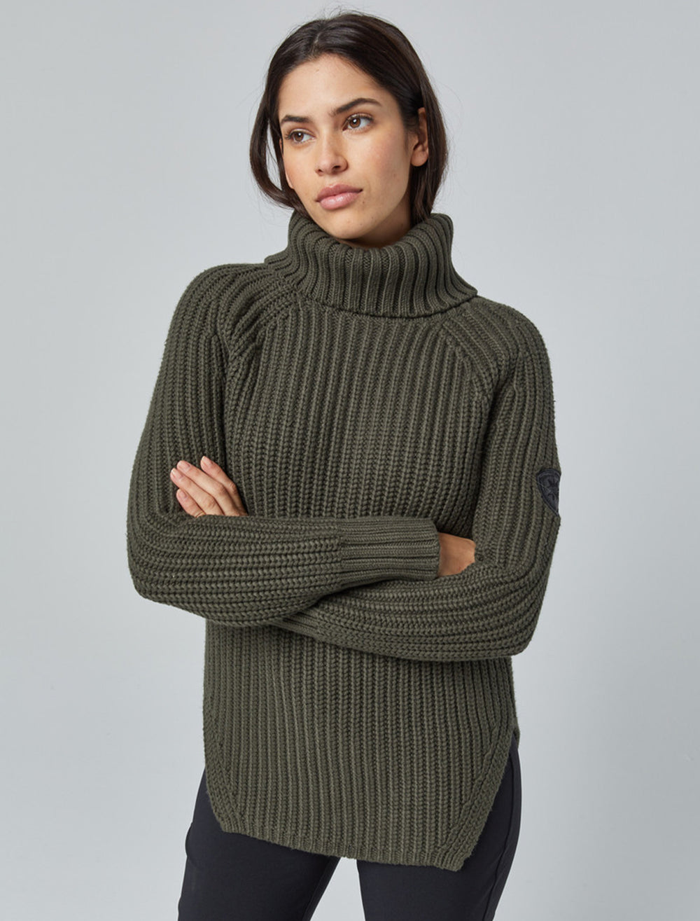 Model wearing Alp N Rock's simone sweater in olive.