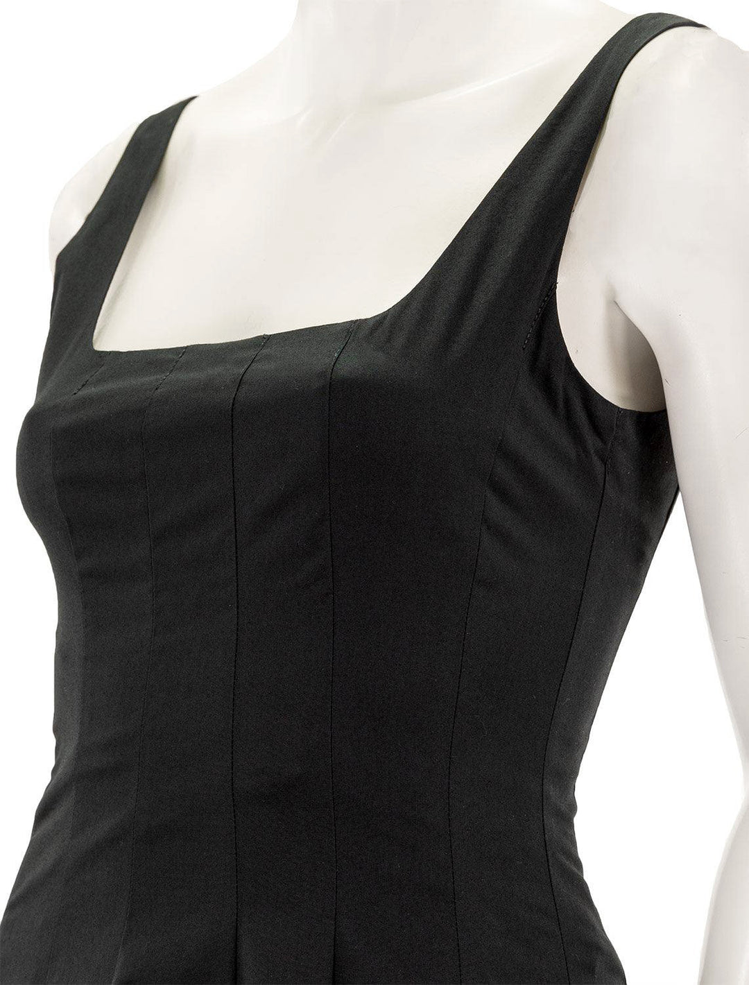 Close-up view of STAUD's wells dress in black.
