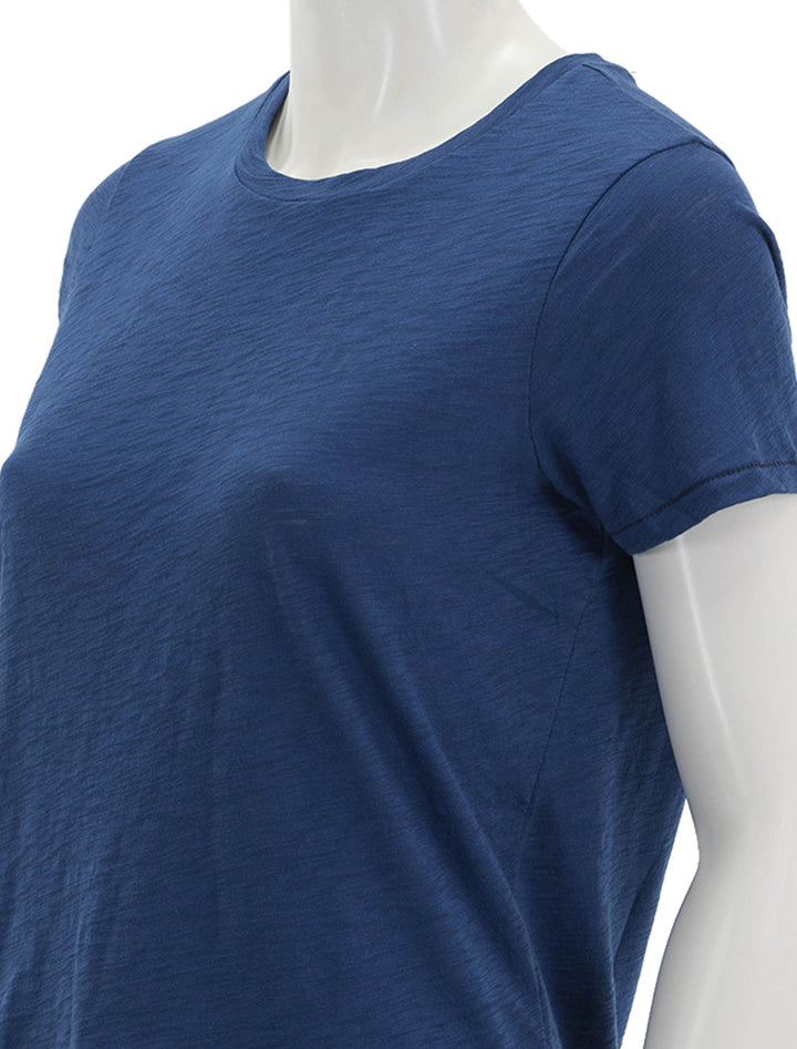 Close-up view of Goldie Lewinter's short sleeve contrast stitch boy tee in navy peony/black.