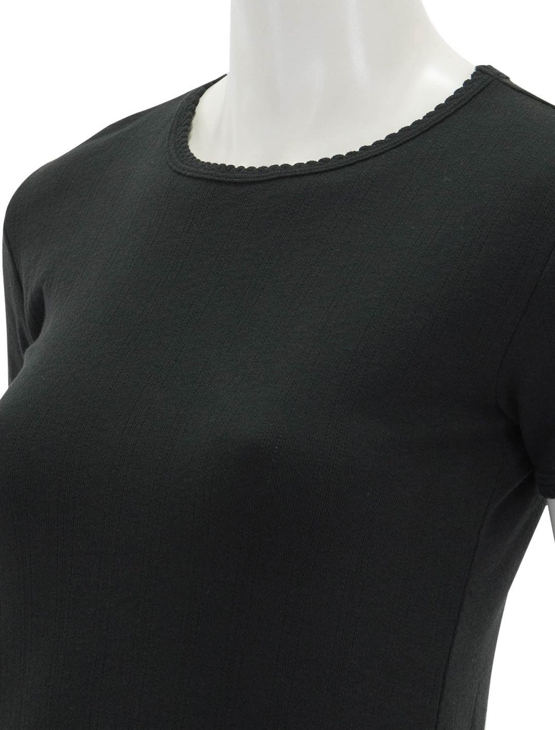 Close-up view of Goldie Lewinter's short sleeve pointelle tee in black.
