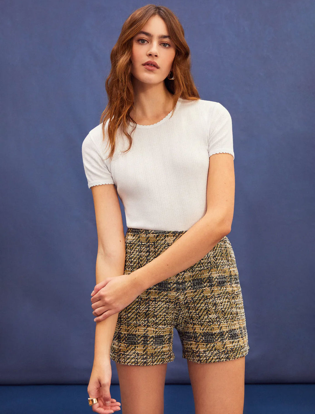 Model wearing Goldie Lewinter's short sleeve pointelle tee in white.