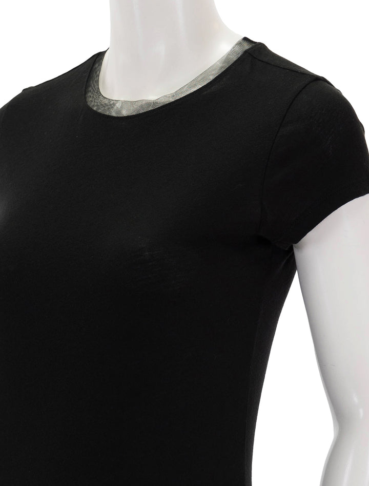Close-up view of Goldie Lewinter's short sleeve mesh trim tee in black.