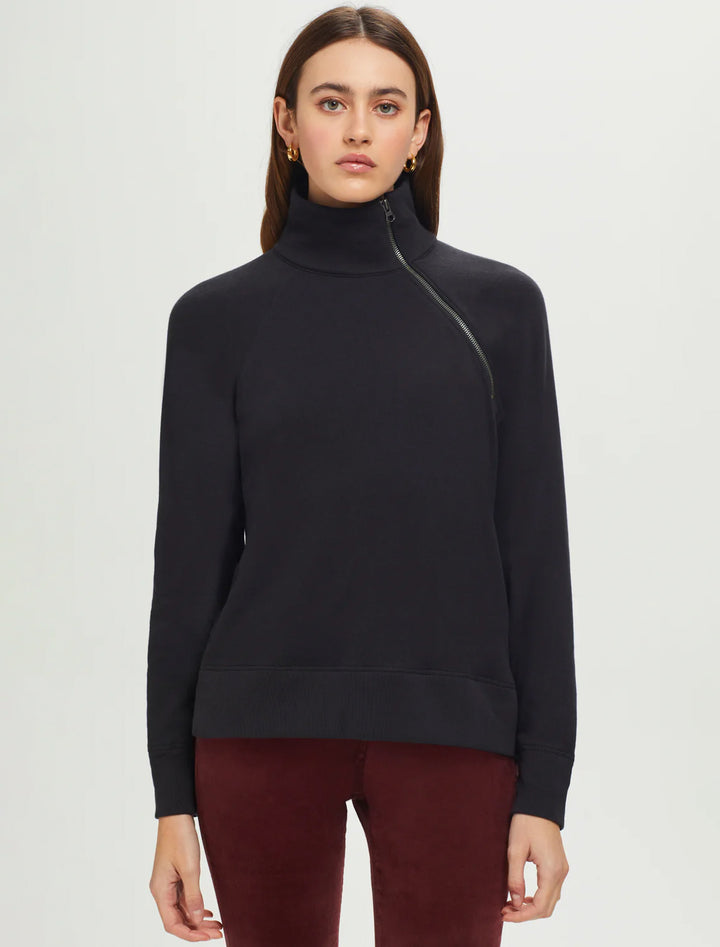 Model wearing Goldie Lewinter's raglan zipneck sweatshirt in black.