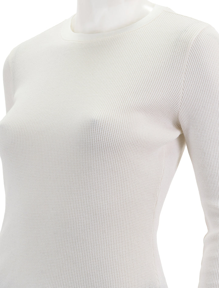 Close-up view of Goldie Lewinter's long sleeve waffle crew in white.