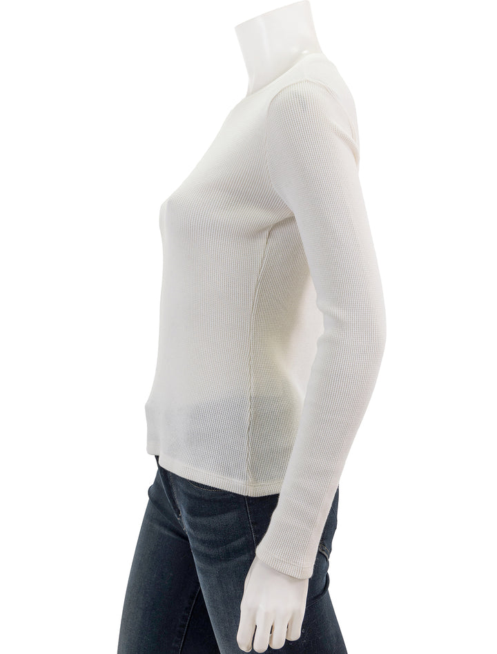 Side view of Goldie Lewinter's long sleeve waffle crew in white.
