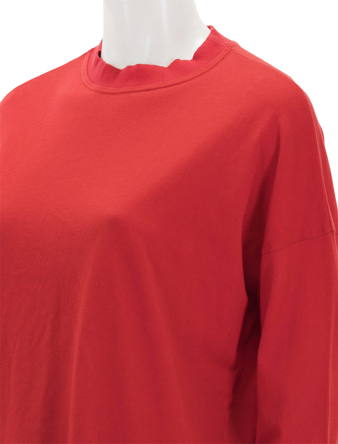 Close-up view of ASKK NY's long sleeve tee in cherry red.