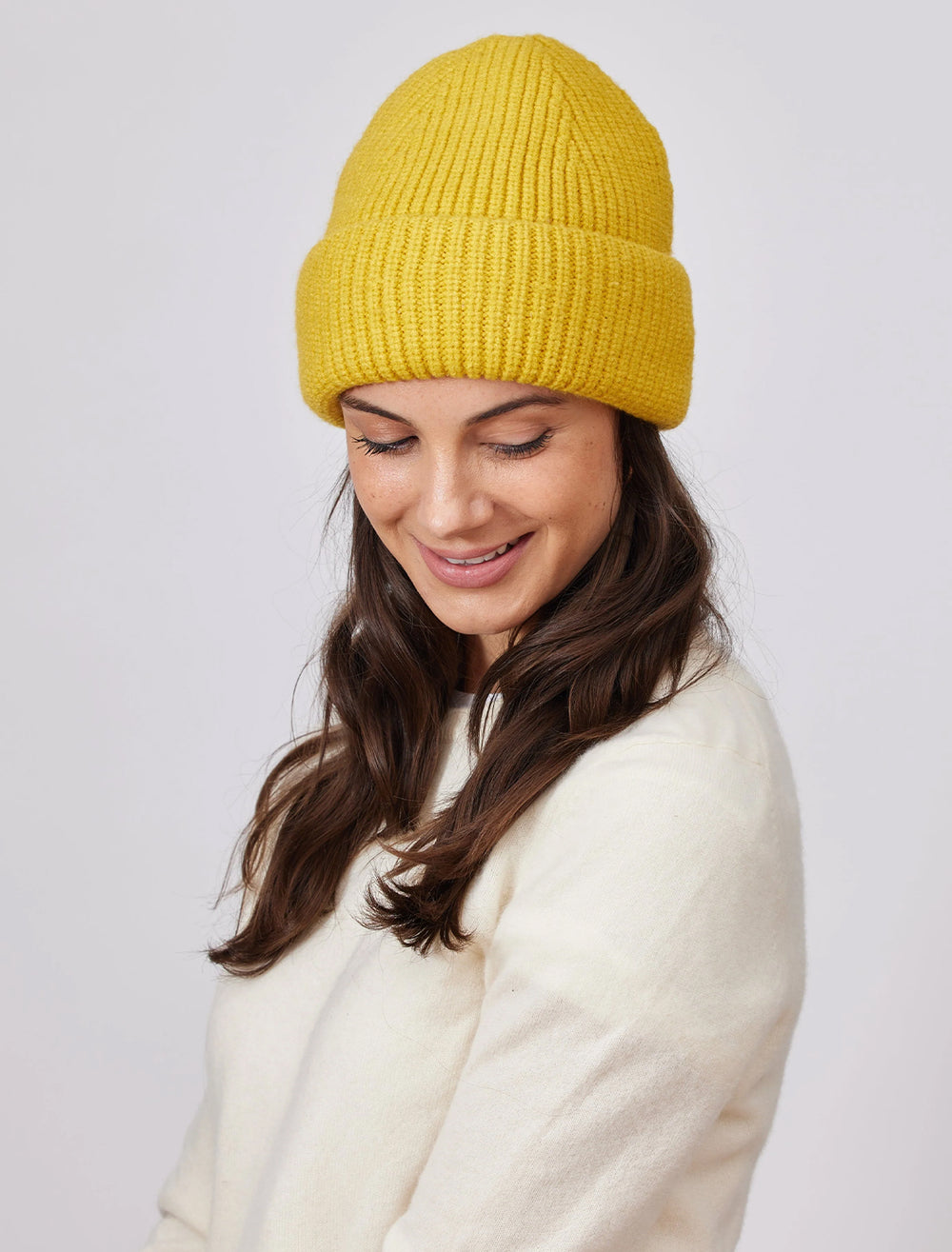 Model wearing Hat Attack's major beanie in yellow.