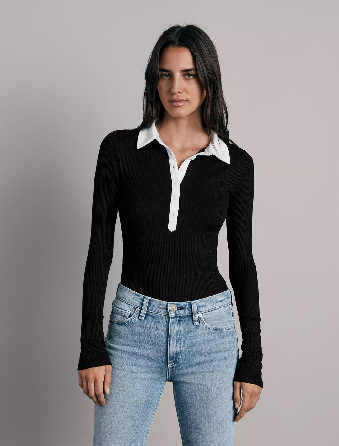 model wearing knit colorblock long sleeve polo in black