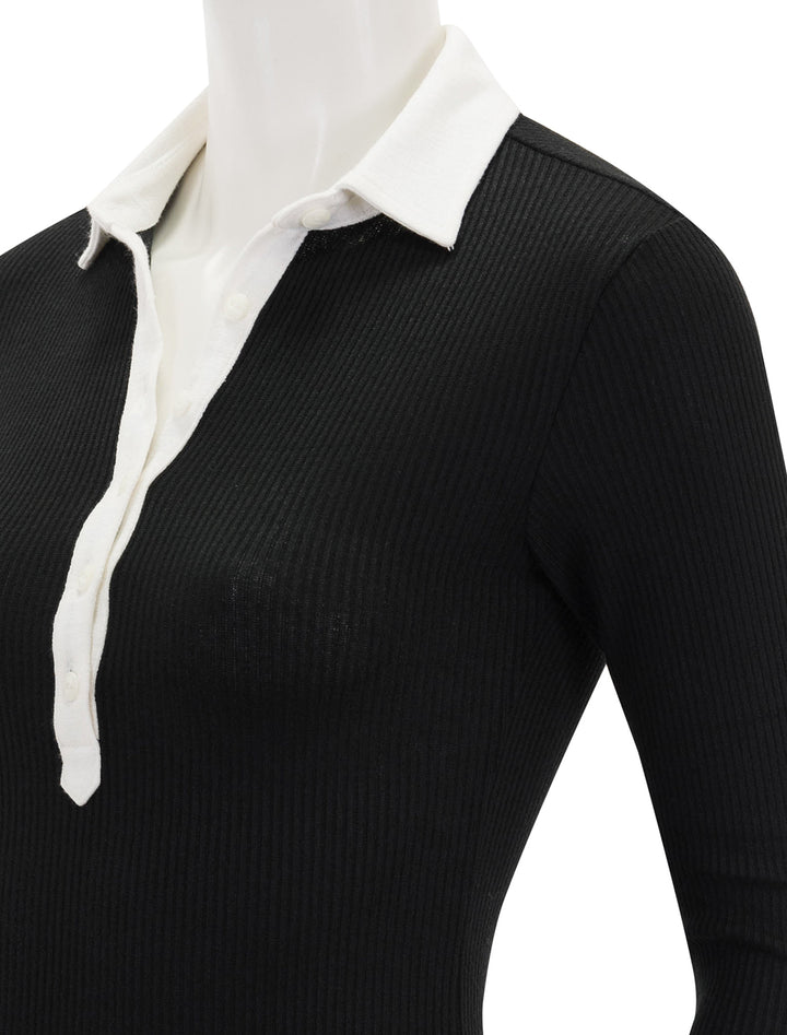 close up view of knit colorblock long sleeve polo in black