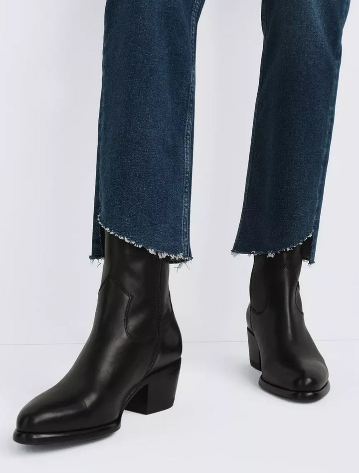 Model wearing Rag & Bone's mustang boots in black.