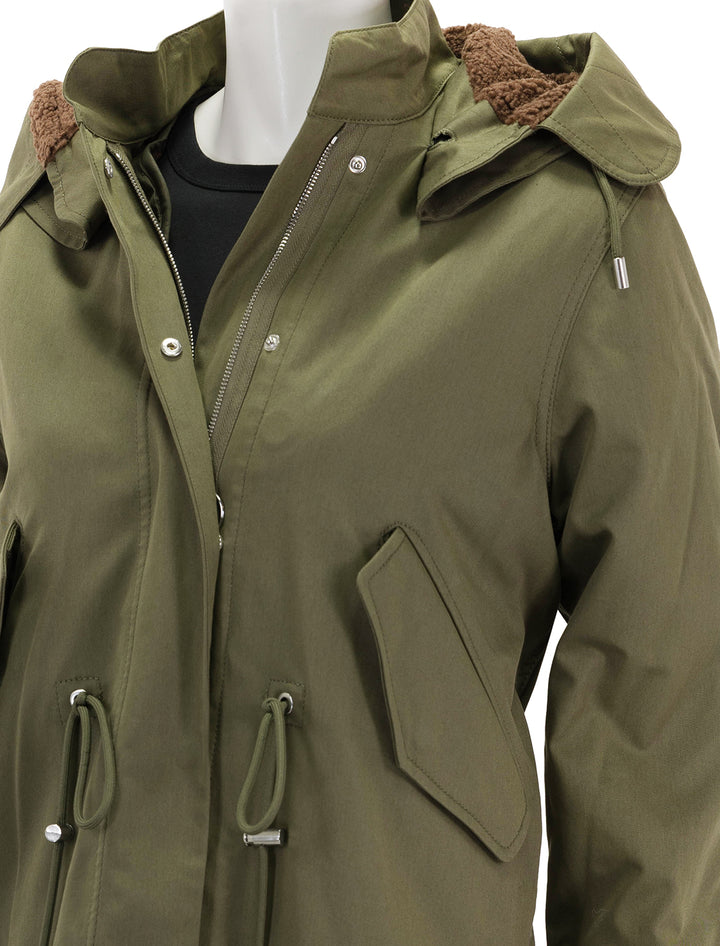 close up view of marisa parka coat in army green and chestnut