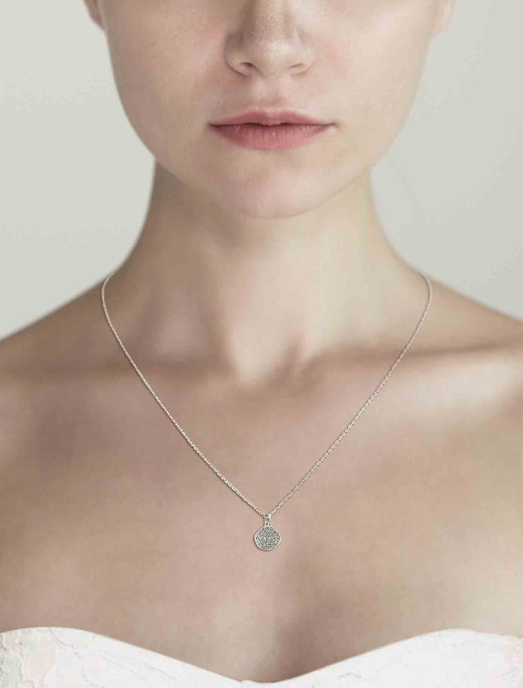 Model wearing Tai Jewelry's Silver Chain Necklace with CZ Wavy Disc.