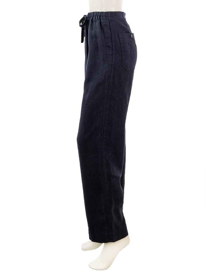 Side view of Vince's mid waist tie front pull on pant in coastal.