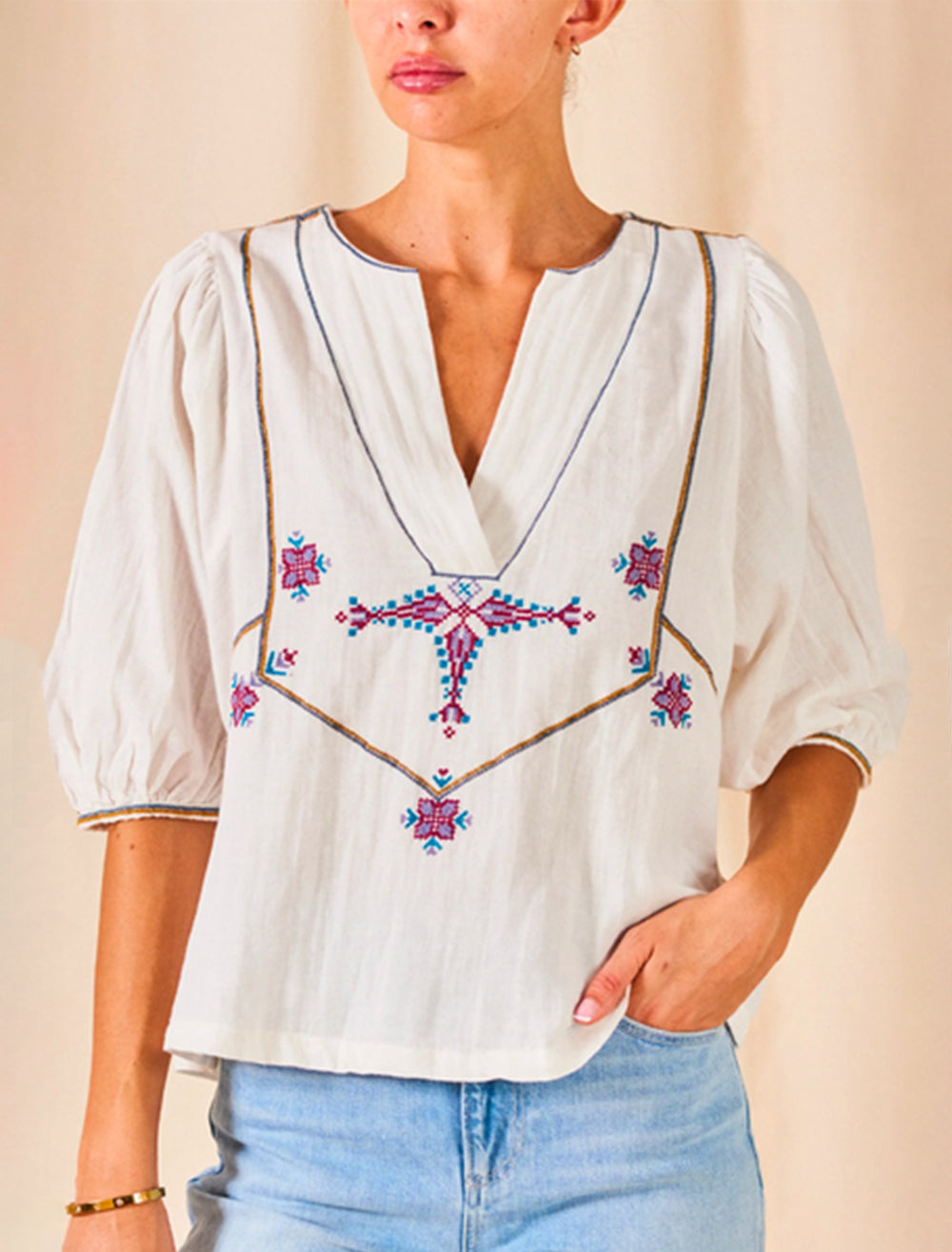 Model wearing M.A.B.E.'s vivien embroidered top in ecru.