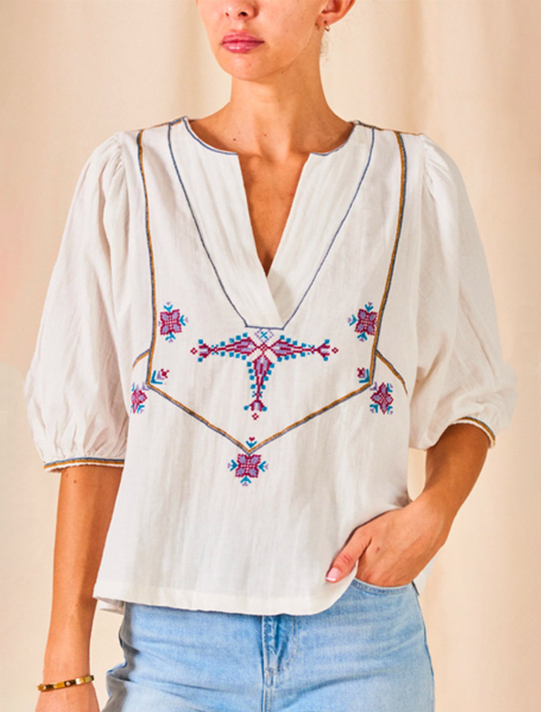 Model wearing M.A.B.E.'s vivien embroidered top in ecru.