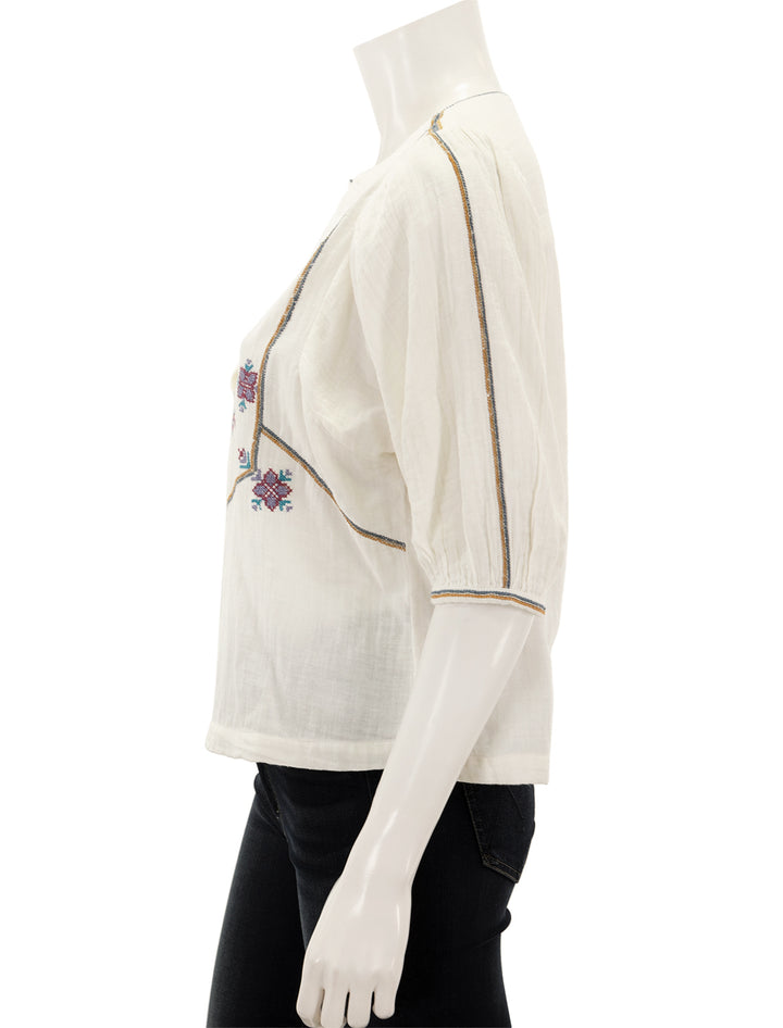 Side view of M.A.B.E.'s vivien embroidered top in ecru.