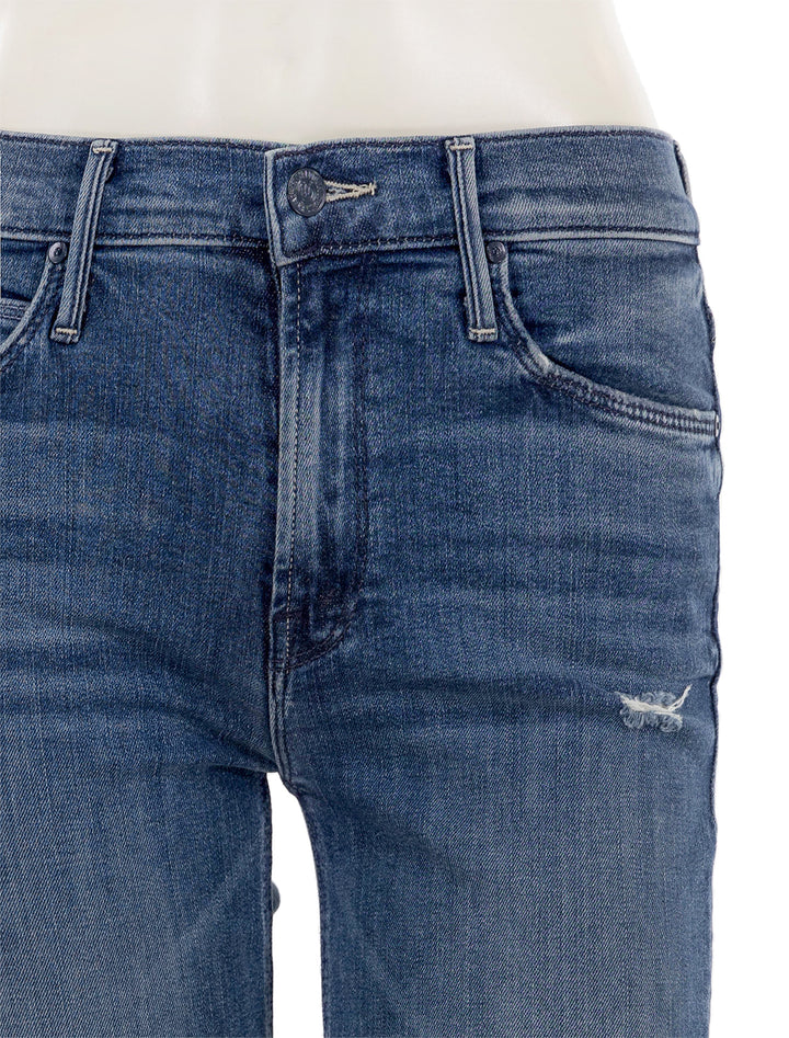 Close-up view of Mother Denim's mid rise dazzler ankle fray in weekend warrior.