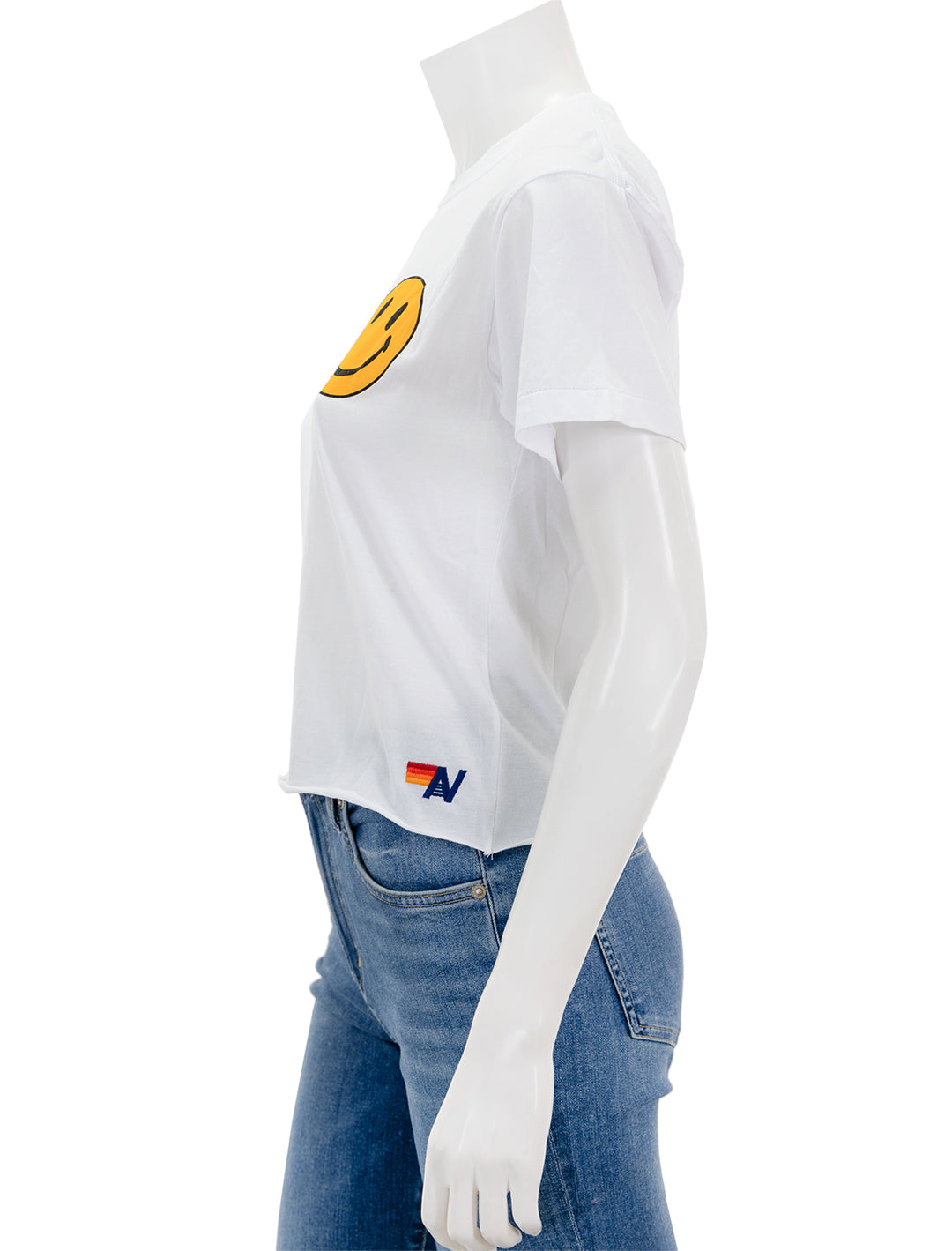 Side view of Aviator Nation's smiley 2 boyfriend tee in white.