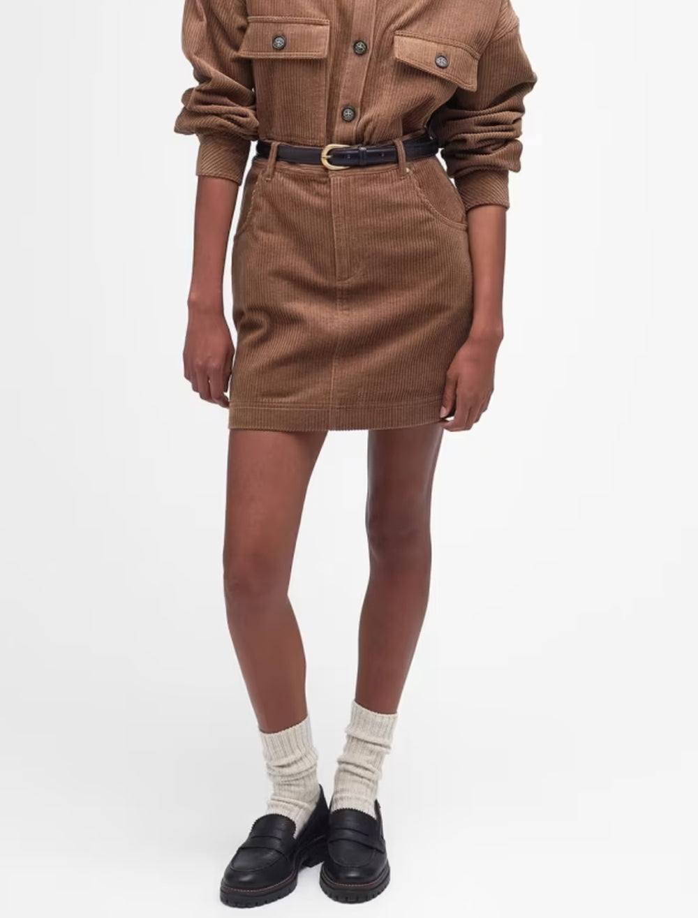 Model wearing Barbour's oakfield skirt in taupe corduroy.