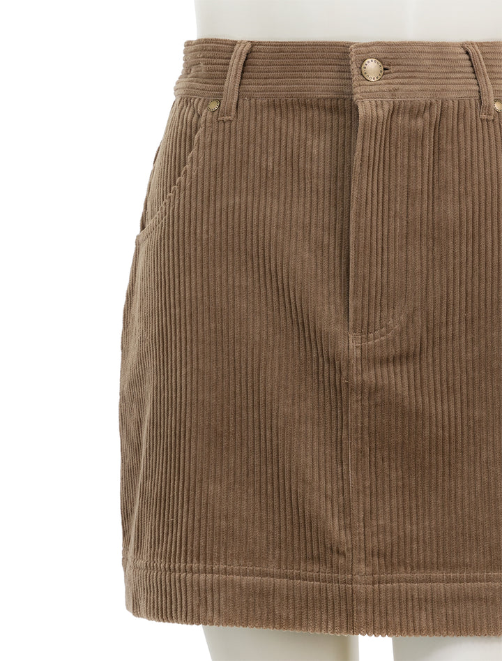 Close-up view of Barbour's oakfield skirt in taupe corduroy.