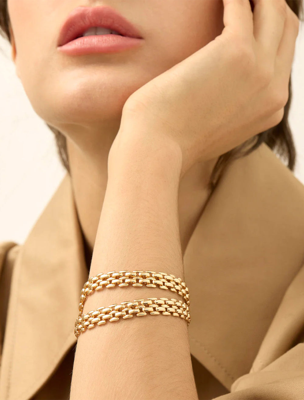 Model wearing Jenny Bird's francis mega bracelet in gold.