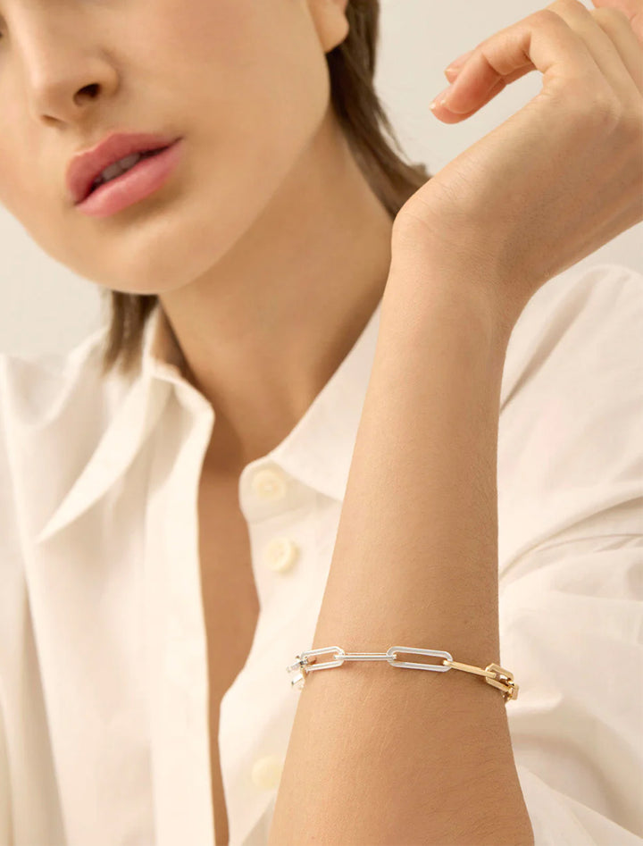 Model wearing Jenny Bird's andi slim bracelet in two tone.
