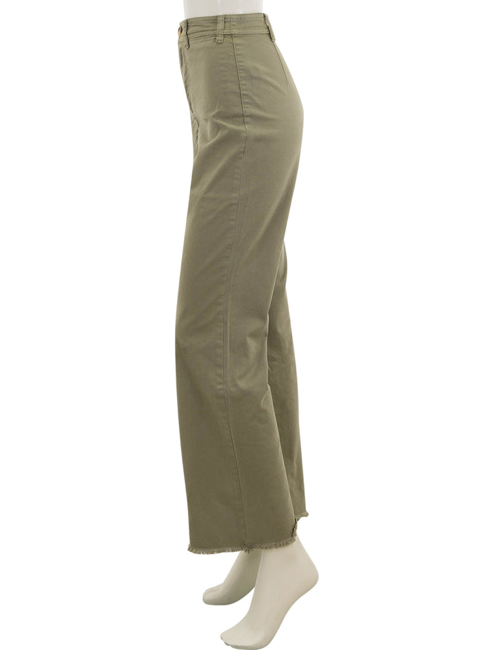 Side view of Marine Layer's bridget pant in aloe with raw edge.