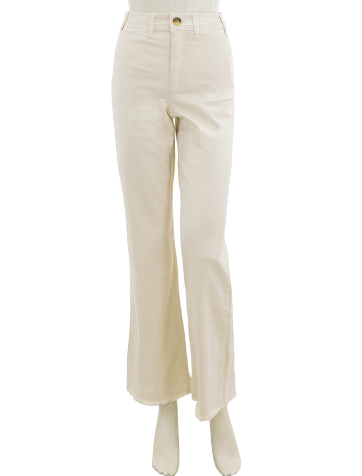 Front view of Marine Layer's bridget pant in cream with raw hem.