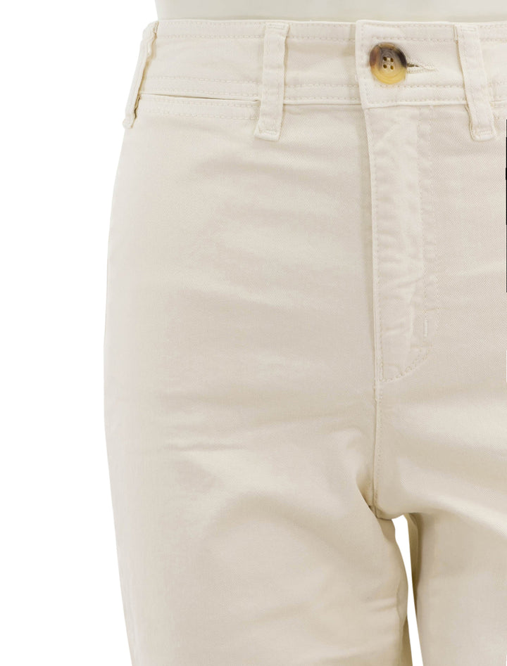 Close-up view of Marine Layer's bridget pant in cream with raw hem.