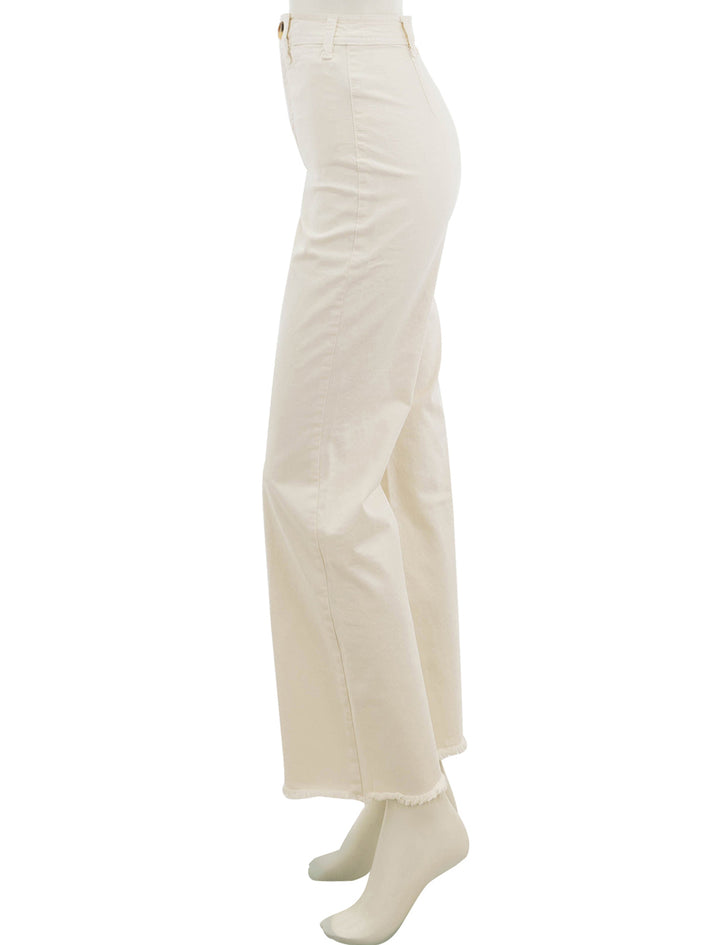 Side view of Marine Layer's bridget pant in cream with raw hem.