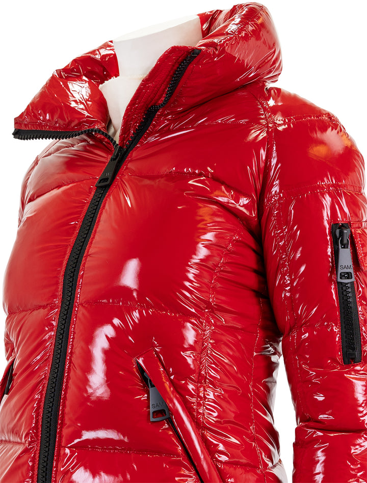 Close-up view of SAM.'s freestyle jacket in salsa.