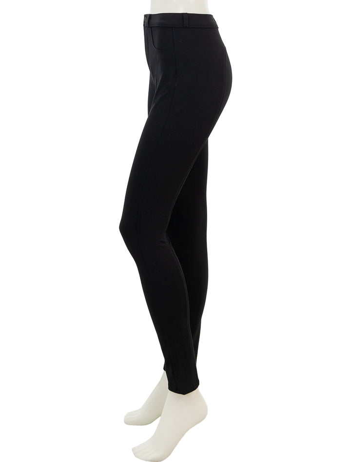 Side view of L'agence's asher high rise seamed skinny pant in black.
